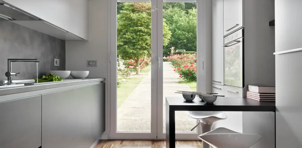 interior of a modern kitchen with wooden floor in the background the window overlooking the garden